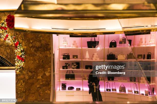 Doorman standing inside an Ivanka Trump brand store is reflected in a mirror at Trump Tower in New York, U.S., on Thursday, Dec. 14, 2017. Trump's...