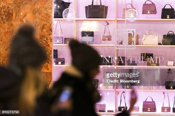 Pedestrians pass in front of an Ivanka Trump brand store at Trump Tower in New York, U.S., on Thursday, Dec. 14, 2017. Trump's new store marks her...