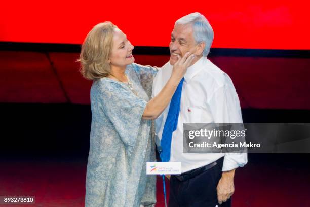 Cecilia Morel caresses Sebastian Piñera , upon his arrival at the closing rally of the campaign at the Caupolicán Theater, on December 14, 2017 in...