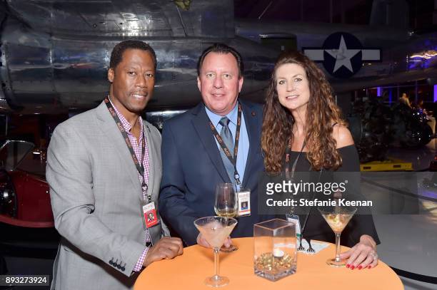 Paul Campbell, Craig Peterson and Lisa Peterson attend Elite Aerospace Group's 4th Annual Aerospace & Defense Symposium at Lyon Air Museum on...
