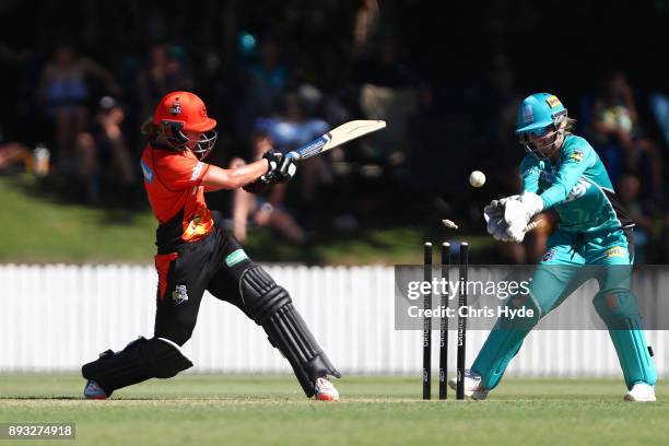 Mathilda Carmichael of the Scorchers hits the ball onto the stumps during the Women's Big Bash League match between the Brisbane Heat and the Perth...