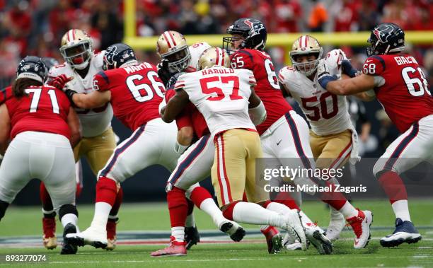 Eli Harold of the San Francisco 49ers sacks Tom Savage of the Houston Texans during the game at NRG Stadium on December 10, 2017 in Houston, Texas....