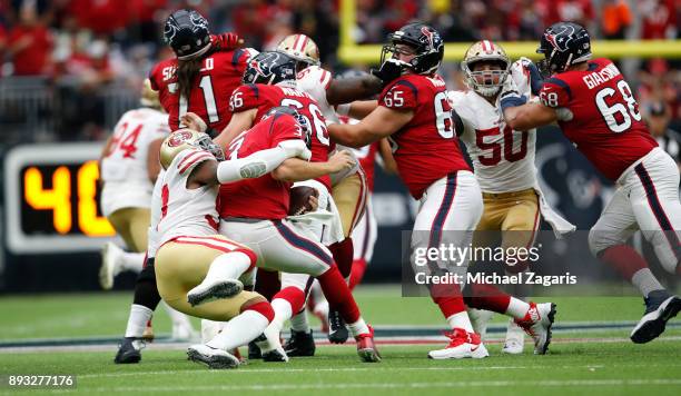 Eli Harold of the San Francisco 49ers sacks Tom Savage of the Houston Texans during the game at NRG Stadium on December 10, 2017 in Houston, Texas....