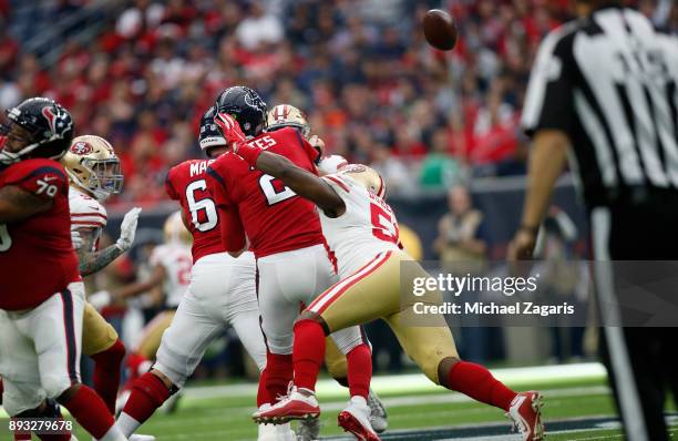Elvis Dumervil of the San Francisco 49ers pressures T.J. Yates of the Houston Texans during the game at NRG Stadium on December 10, 2017 in Houston,...