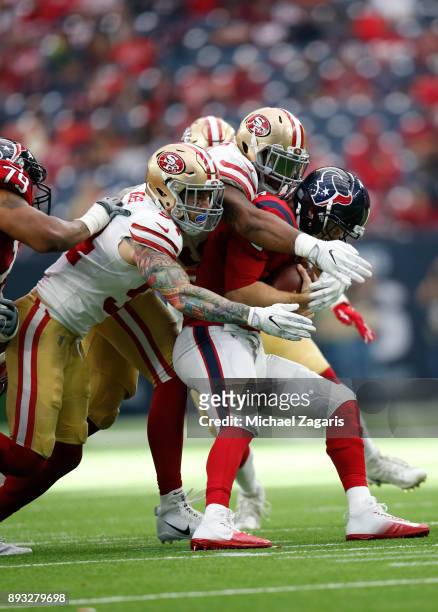 Cassius Marsh and DeForest Buckner of the San Francisco 49ers sack T.J. Yates of the Houston Texans during the game at NRG Stadium on December 10,...