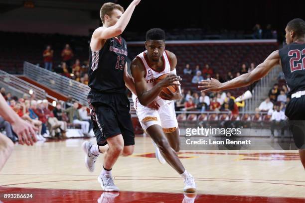 Chimezie Metu of the USC Trojans handles the ball against Josip Vrankic of the Santa Clara Broncos during a college basketball game at Galen Center...
