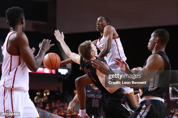 Shaqquan Aaron of the USC Trojans handles the ball against Josip Vrankic of the Santa Clara Broncos during a college basketball game at Galen Center...