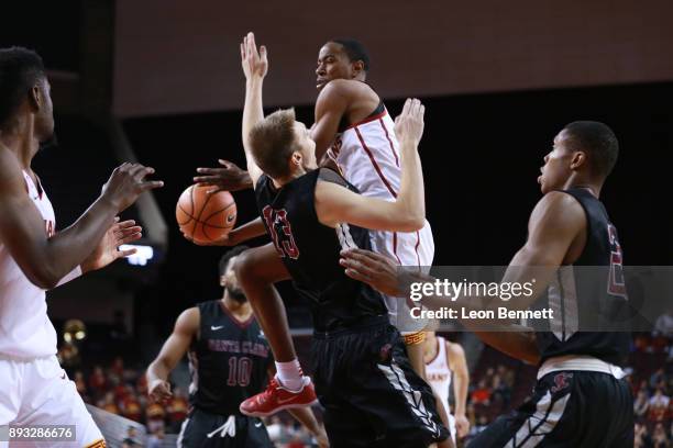 Shaqquan Aaron of the USC Trojans handles the ball against Josip Vrankic of the Santa Clara Broncos during a college basketball game at Galen Center...