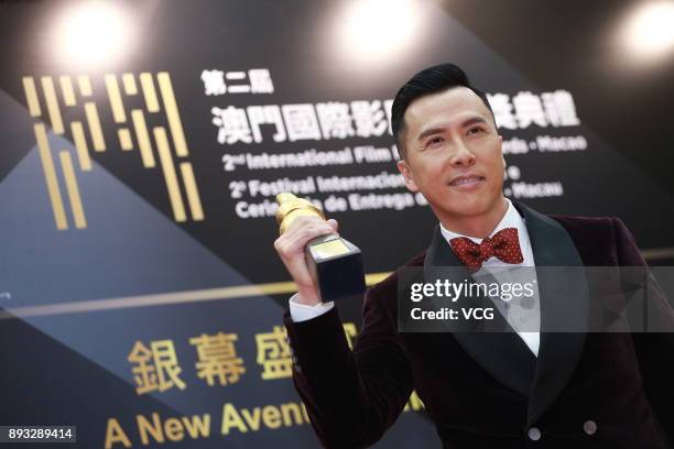 Actor Donnie Yen, winner of International Star of The Year, poses during the award ceremony for the 2nd International Film Festival & Awards Macao on...