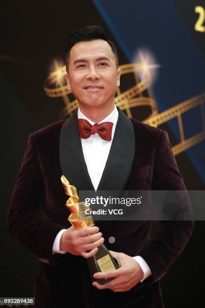 Actor Donnie Yen poses with trophy at backstage during the award ceremony of the 2nd International Film Festival & Awards Macao on December 14, 2017...