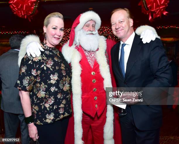 Sara Dodd, Santa Claus and Will Denton attend A Christmas Cheer Holiday Party 2017 Hosted by George Farias and Anne and Jay McInerney at The Doubles...