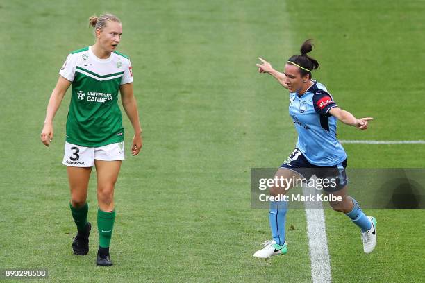 Clare Hunt of Canberra United looks dejected as Lisa De Vanna of Sydney FC celebrates scoring a goal during the round eight W-League match between...