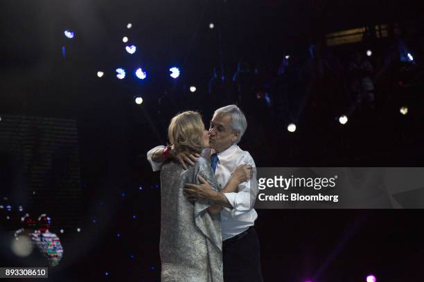 Chile's Former President Sebastian Pinera, presidential candidate for the National Renewal party, kisses his wife Cecilia Morel, during a final...
