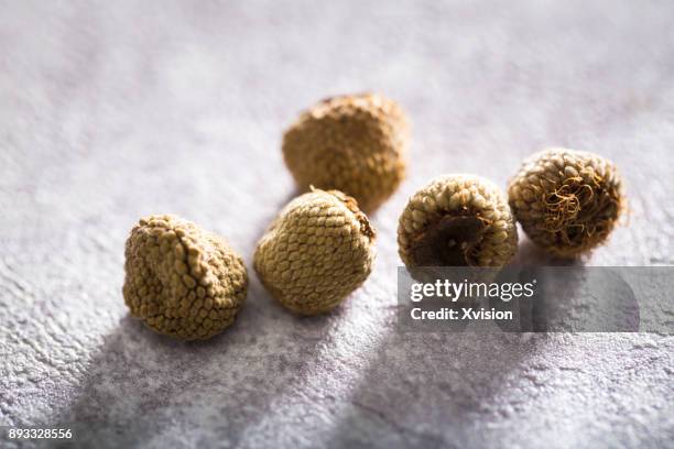 chinese medicine palmleaf raspberry fruit studio shot - ancient chinese medicine stock pictures, royalty-free photos & images