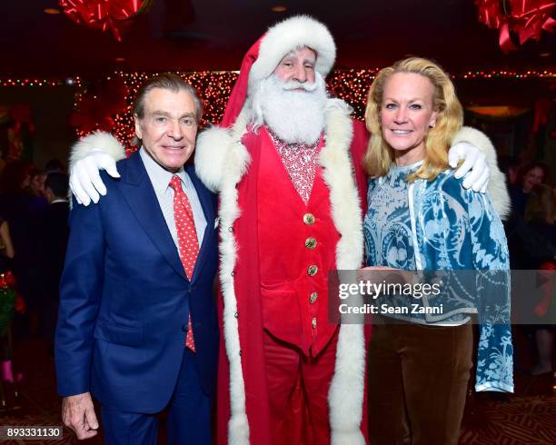 Sherrell Aston, Santa Claus and Muffie Potter Aston attend A Christmas Cheer Holiday Party 2017 Hosted by George Farias and Anne and Jay McInerney at...