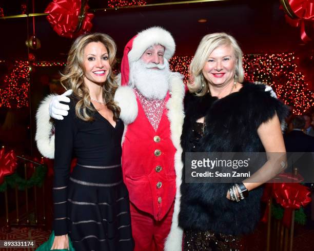 Ulla Parker, Santa Claus and Liliana Cavendish attend A Christmas Cheer Holiday Party 2017 Hosted by George Farias and Anne and Jay McInerney at The...