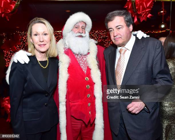 Anne Eisenhower, Santa Claus and Wolfgang Flottl attend A Christmas Cheer Holiday Party 2017 Hosted by George Farias and Anne and Jay McInerney at...