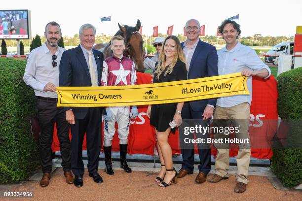 Connections of Twitchy Frank after winning the MMR Creative Agency Handicap at Moonee Valley Racecourse on December 15, 2017 in Moonee Ponds,...