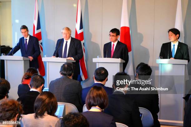Britain's Foreign Secretary Boris Johnson, second left, speaks alongside Defence Secretary Gavin Williamson, left, and their Japanese counterparts...