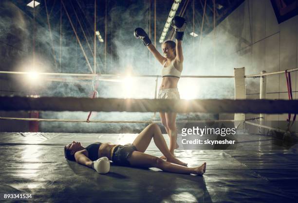knockout on a boxing match! - boxing womens stock pictures, royalty-free photos & images