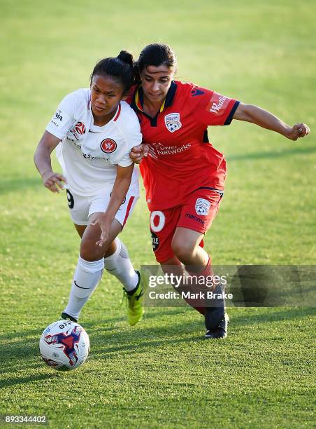 Rasamee Phonsongkham of Western Sydney Wanderers competes with Alexandra Chidiac of Adelaide United during the round eight W-League match between...