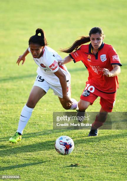 Rasamee Phonsongkham of Western Sydney Wanderers competes with Alexandra Chidiac of Adelaide United during the round eight W-League match between...