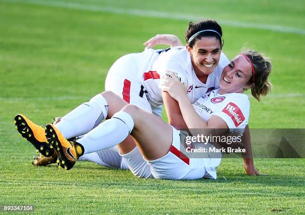 Marlous Pieete of Western Sydney Wanderers FC celebrates scoring a goal with Lee Falkon of Western Sydney Wanderers FC during the round eight...