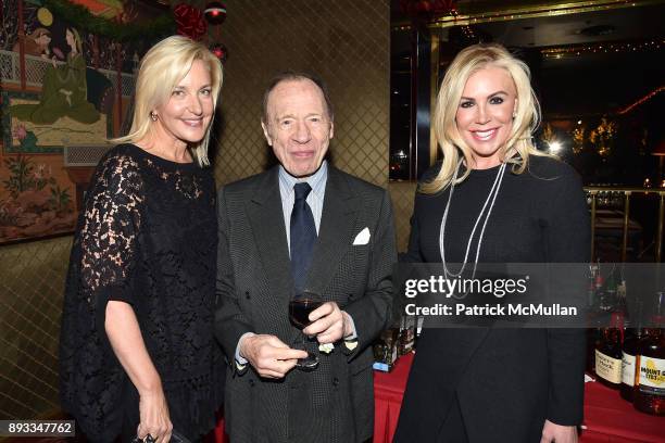 Karin Luter, Anthony Haden-Guest and Amy Phelan attend A Christmas Cheer Holiday Party 2017 Hosted by George Farias, Anne and Jay McInerney at The...