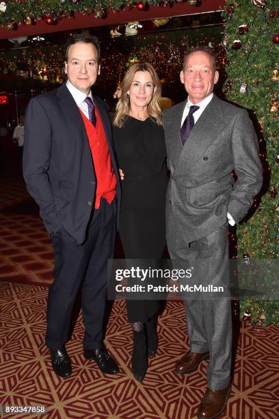 George Farias, Paula Peck and Tony Peck attend A Christmas Cheer Holiday Party 2017 Hosted by George Farias, Anne and Jay McInerney at The Doubles...