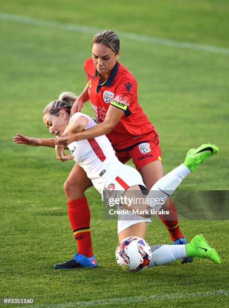 Emma Checker of Adelaide United tackles Erica Halloway of Western Sydney Wanderers FC during the round eight W-League match between Adelaide United...