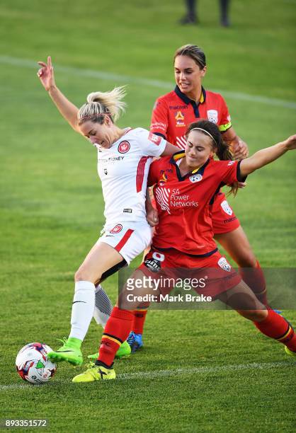 Erica Halloway of Western Sydney Wanderers FC under pressure from Georgia Campagnale of Adelaide United during the round eight W-League match between...