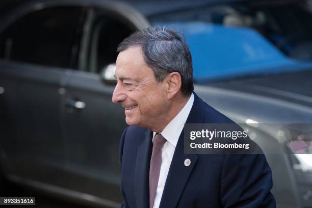 Mario Draghi, president of the European Central Bank , arrives at a summit of 27 European Union leaders in Brussels, Belgium, on Friday, Dec. 15,...