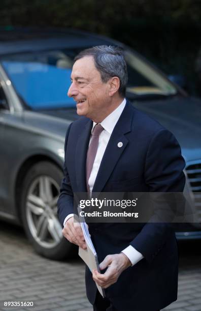 Mario Draghi, president of the European Central Bank , arrives at a summit of 27 European Union leaders in Brussels, Belgium, on Friday, Dec. 15,...