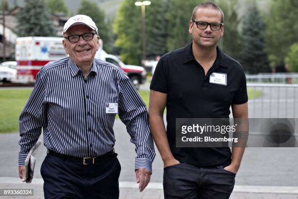 Rupert Murdoch, chairman and chief executive officer of News Corp., left, walks with his son Lachlan Murdoch, a board member of News Corp., while...