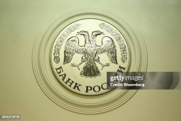 The seal of the Russian Central bank, also known as Bank Rossii, sits on display at the headquarters of Bank Rossii, Russia's central bank, ahead of...