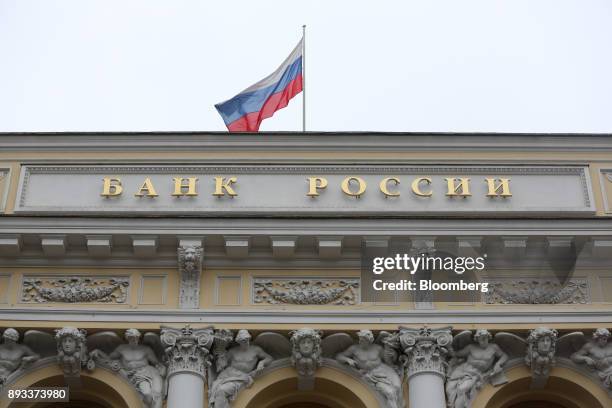 Russian national flag flies above the headquarters of Bank Rossii, Russia's central bank, ahead of a news conference to announce interest rates in...