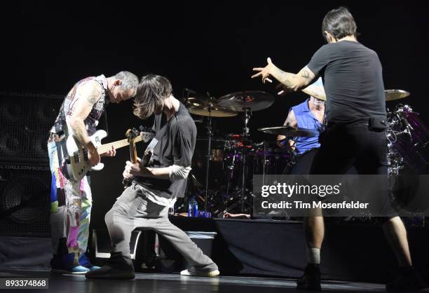 Flea, Josh Klinghoffer, Chad Smith and Anthony Kiedis of Red Hot Chili Peppers perform during Band Together 2 at Bill Graham Civic Auditorium on...