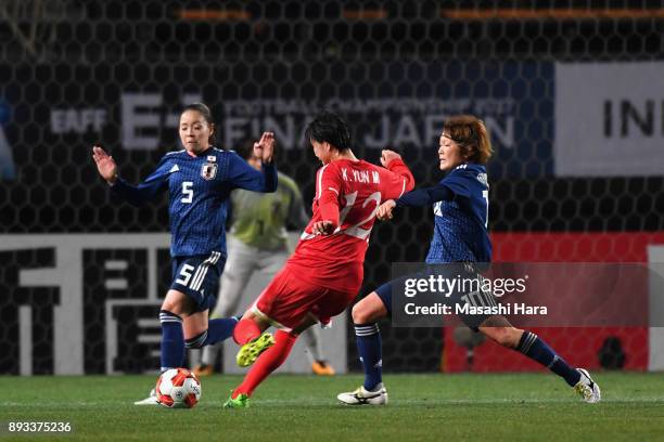 Kim Yun Mi of North Korea scores the opening goal during the EAFF E-1 Women's Football Championship between Japan and North Korea at Fukuda Denshi...