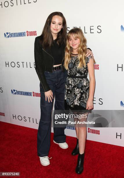 Actors Ava Cooper and Stella Cooper attend the premiere of "Hostiles" at the Samuel Goldwyn Theater on December 14, 2017 in Beverly Hills, California.