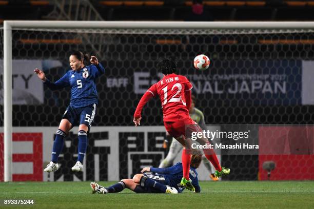 Kim Yun Mi of North Korea scores the opening goal during the EAFF E-1 Women's Football Championship between Japan and North Korea at Fukuda Denshi...