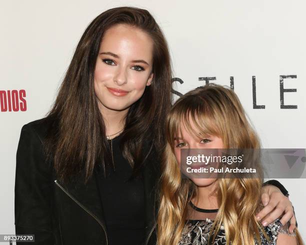 Actors Ava Cooper and Stella Cooper attend the premiere of "Hostiles" at the Samuel Goldwyn Theater on December 14, 2017 in Beverly Hills, California.