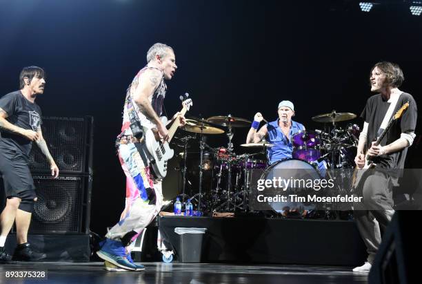Anthony Kiedis, Flea, Chad Smith and Josh Klinghoffer of Red Hot Chili Peppers perform during Band Together 2 at Bill Graham Civic Auditorium on...
