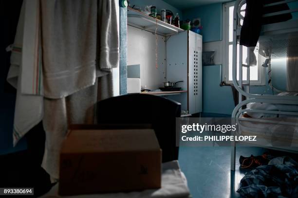 Christmas gift left by the Christian charity organization "Secours Catholique" is seen on a chair in a cell, as part of a distribution of Christmas...