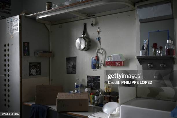 Christmas gifts left by the Christian charity organization "Secours Catholique" are seen on a table in a cell, as part of a distribution of Christmas...