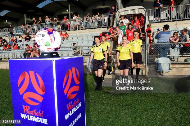 Referees head out during the round eight W-League match between Adelaide United and the Western Sydney Wanderers at Marden Sports Complex on December...