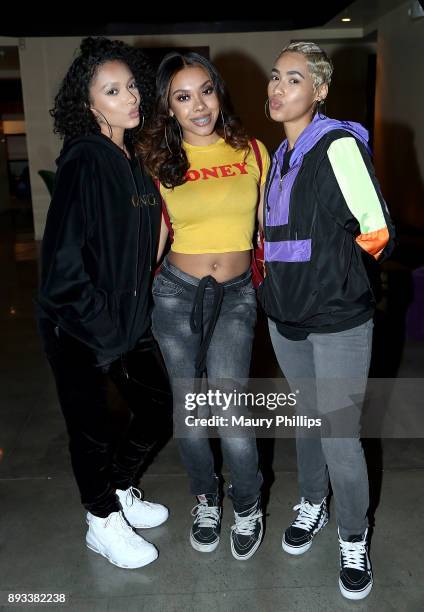 Saiyr, Zeuie and Emaza Gibson of Ceraadi attend Rostrum Records 2017 holiday party on December 14, 2017 in Los Angeles, California.