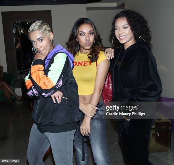 Saiyr, Zeuie and Emaza Gibson of Ceraadi attend Rostrum Records 2017 holiday party on December 14, 2017 in Los Angeles, California.