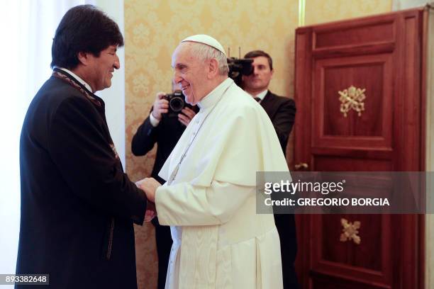 Pope Francis meets with President of Bolivia Evo Morales during a private audience at the Vatican, on December 15, 2017. / AFP PHOTO / POOL /...