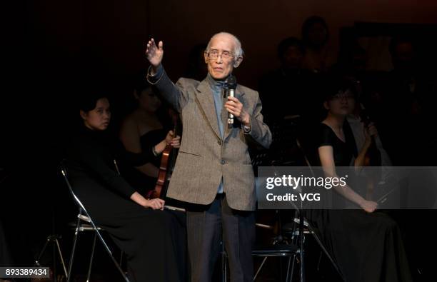 Chinese poet Yu Guangzhong reads his poem 'Nostalgia' during an award ceremony on December 29, 2013 in Haikou, Hainan Province of China. Chinese poet...