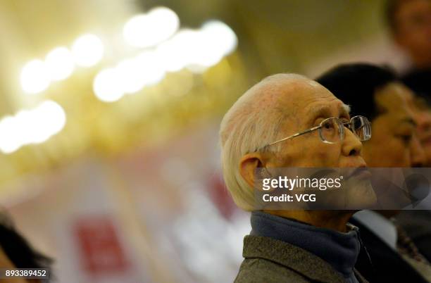 Chinese poet Yu Guangzhong attends an award ceremony on December 29, 2013 in Haikou, Hainan Province of China. Chinese poet Yu Guangzhong died on...